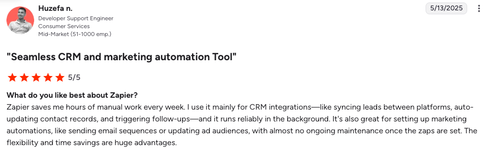 A customer review for Zapier, rated 5 out of 5 stars, highlights its usefulness for CRM integrations, automation, and time-saving benefits.